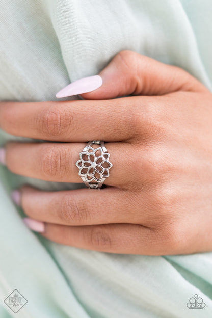 Prana Paradise silver floral Paparazzi ring worn on a hand
